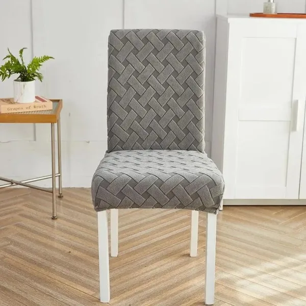 Grijze stoelhoes met geweven houten patroon, geschikt voor eettafelstoel.