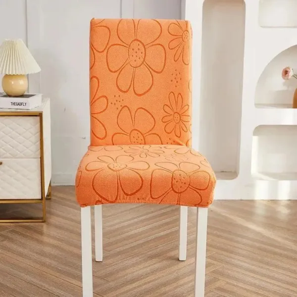 Oranje stoelhoes met bloemenpatroon, geschikt voor eettafelstoel.
